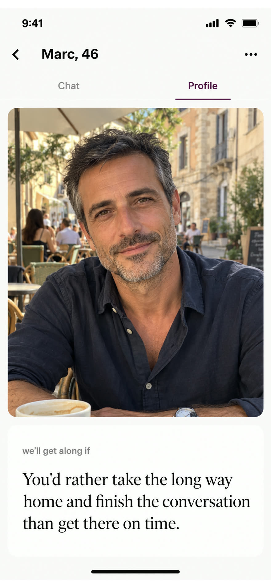 Marc looking towards the camera in natural afternoon light on a café terrace, beside his answer about taking the long way home to finish a conversation.