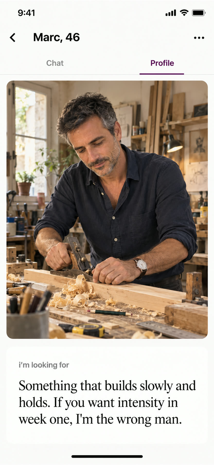 Marc, sleeves rolled, absorbed in a task in his small workshop, paired with his answer about wanting something that builds slowly and holds.